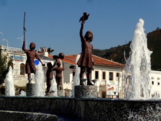 Sculpture and fountain on the stone boardwalk at Marmaris